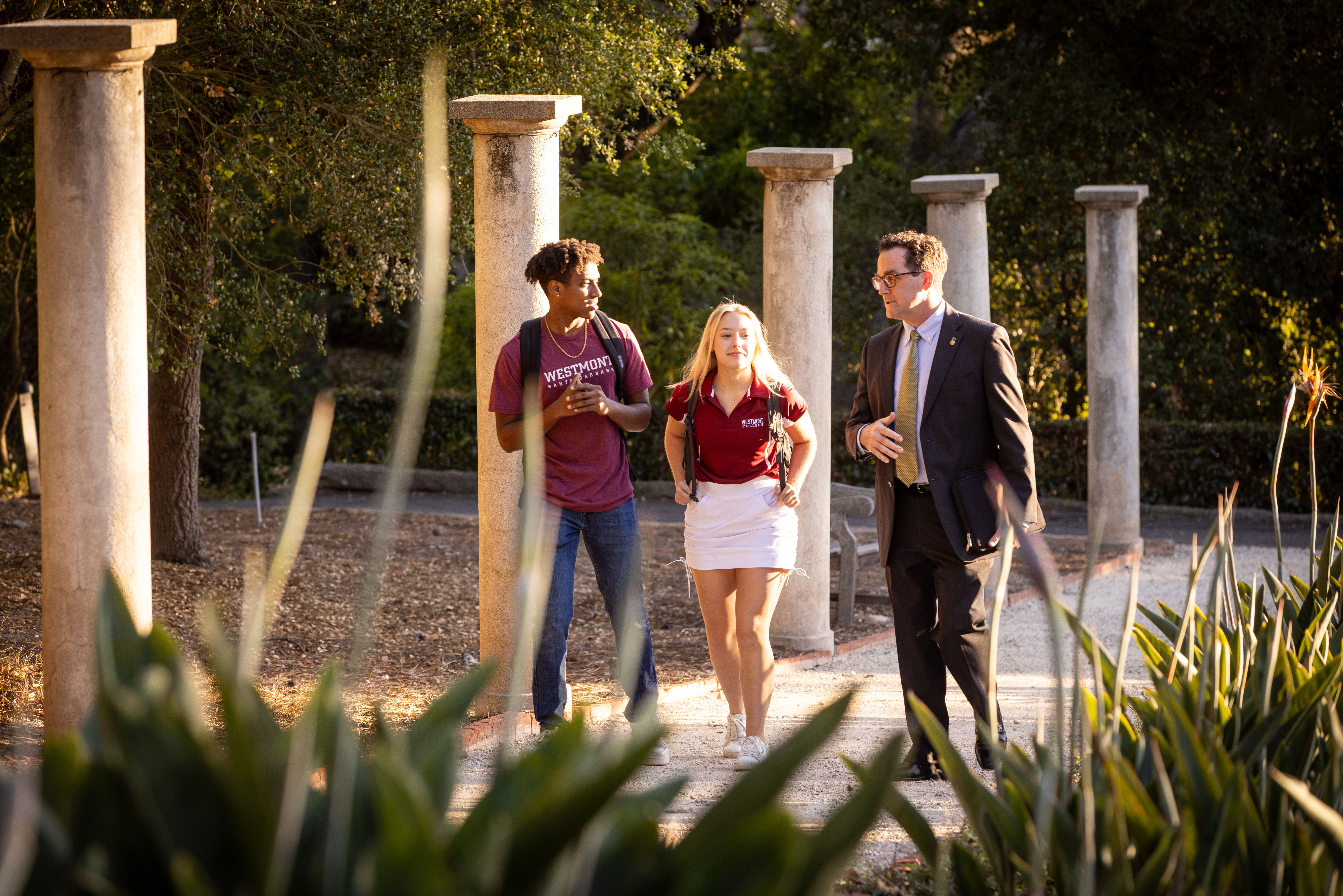 Westmont students walking with professor on campus