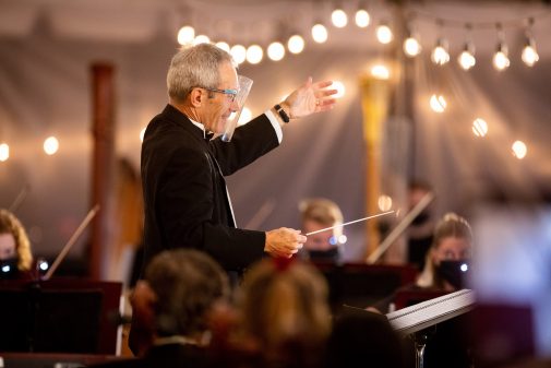 Dr. Michael Shasberger conducts outdoors